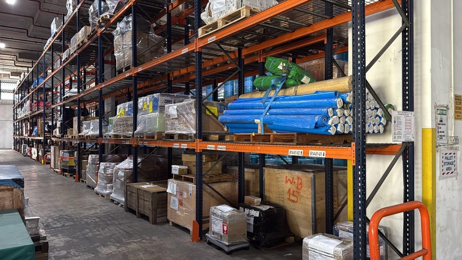 Warehouse pallet racking holding packed and industrial cargo